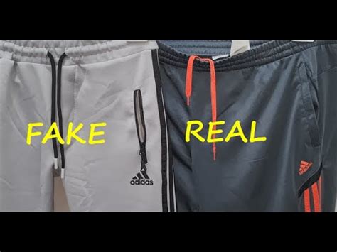 how to spot fake adidas tracksuit|adidas tracksuit pants.